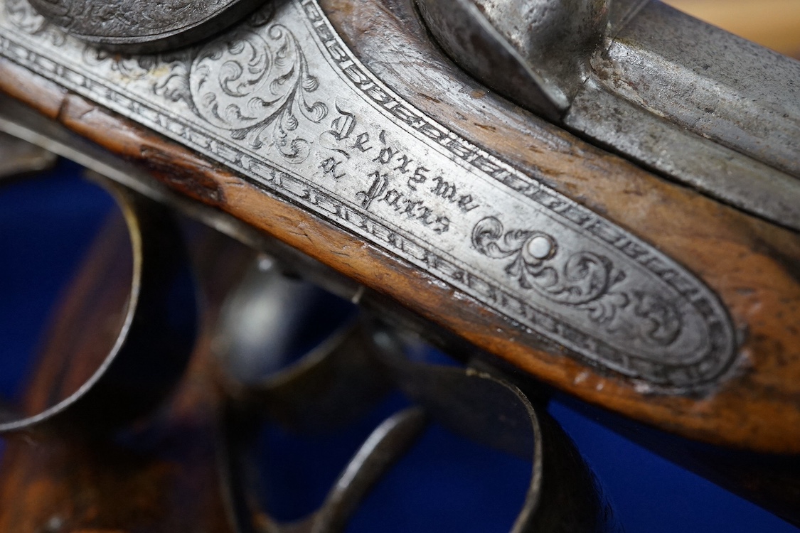 A pair of 40 bore percussion target pistols by Devisme of Paris, octagonal barrels cut with multi-groove rifling, engraved and signed locks, steel furniture ensuite, fluted walnut butts, half stocked, with gold inlaid nu
